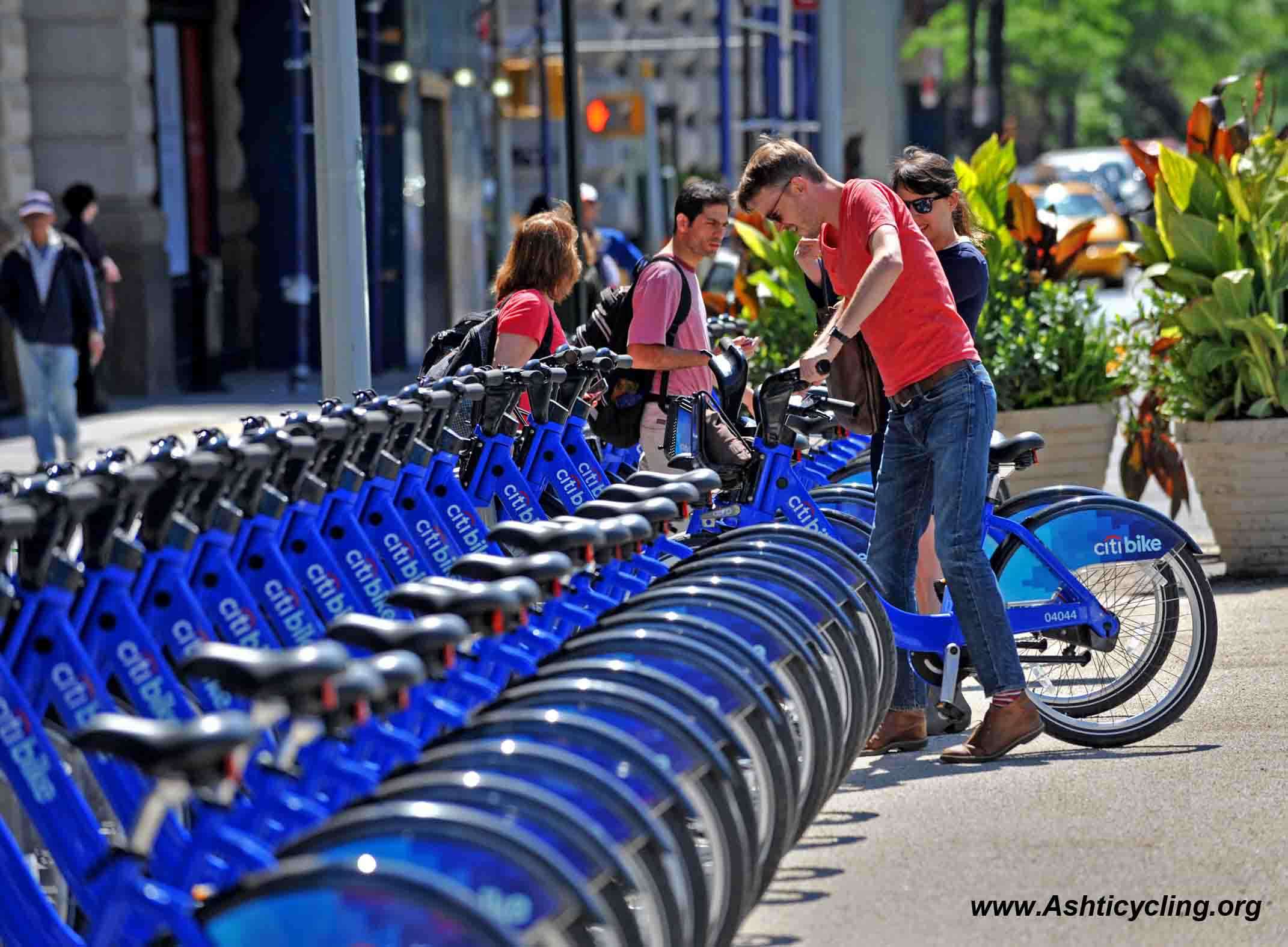 With AFP Story by Brigitte DUSSEAU: US-Transport-Bicycle-Share-CitiBike A couple get their Citi Bike bicycles from a station near Union Square as the bike sharing system is launched May 27, 2013 in New York. About 330 stations in Manhattan and Brooklyn will have thousands of bicycles for rent. AFP PHOTO/Stan HONDA (Photo credit should read STAN HONDA/AFP/Getty Images)
